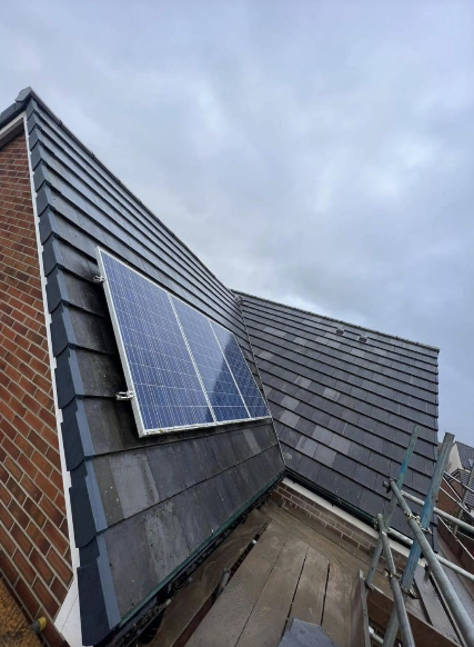 Slate roof with solar panel installation